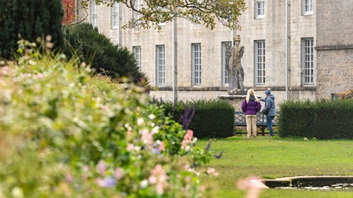 Family enjoying the Terraces in the garden at Plas Newydd